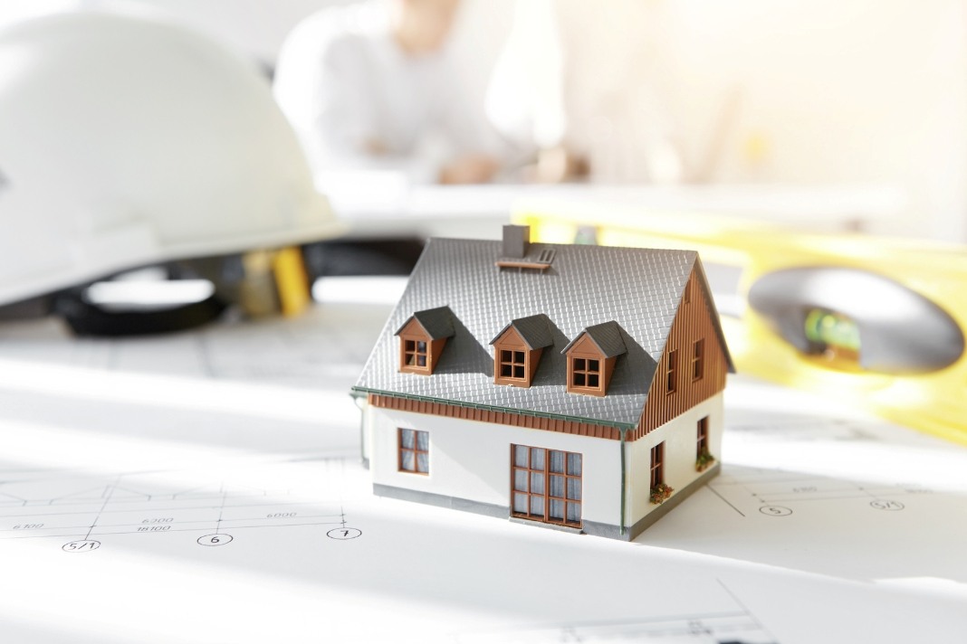Model house on property plans showing ActivePropertyCare Brendan rental property guidance for landlords and property care decisions.