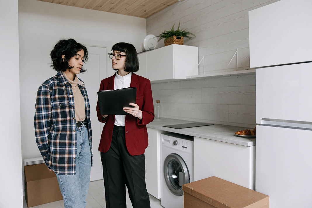 Property manager and tenant reviewing condition during a rental move-in inspection